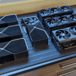 Photo of multiple GPUs on counter - NVIDIA GeForce RTX 4090 24GB FE, PNY GeForce RTX 4090 XLR8 24GB, Asus GeForce RTX 4090 TUF 24GB