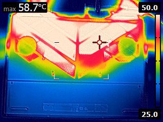 FLIR image of the bottom of the laptop. There is a triangular vented area with a base on the screen-side edge and a tip ending about two-thrids the way down the laptop. This entire triangle area is a birght red to white, representing greater than or equal to 50 degrees on the calibrated scale. There is an indicator stating that the highest recorded temperature is 58.7 degrees celcius.