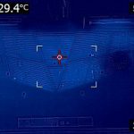 FLIR image of the bottom of the laptop. There is a triangular vented area with a base on the screen-side edge and a tip ending about two-thrids the way down the laptop. The entire bottom of the laptop is dark (25 C) to medium blue. There is an indicator stating that the highest recorded temperature is 29.4 degrees celcius.