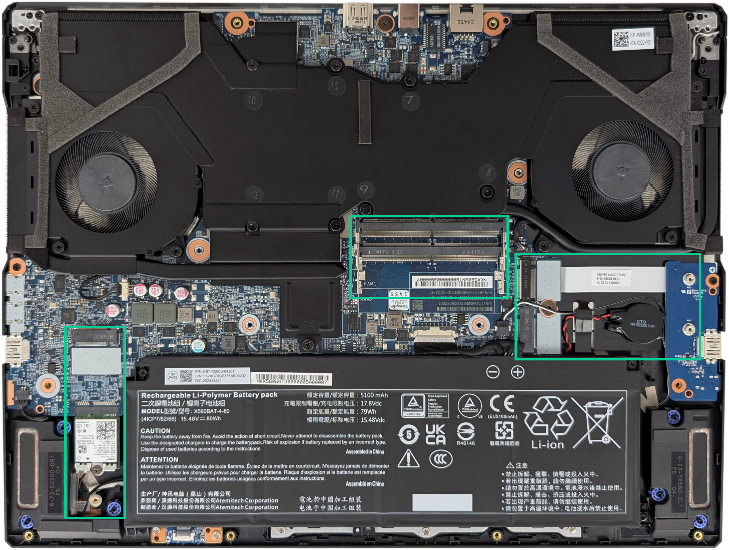 The same image of the internals of the laptop, but with the M.2 drive slots and RAM slots highlighted with green rectangles around them.