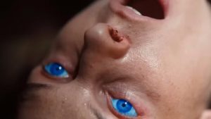 A character with glowing blue eyes from spice exposure in dune part two